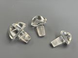 three pieces of clear quartz on a gray surface