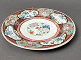 a plate with a design on it sitting on a table