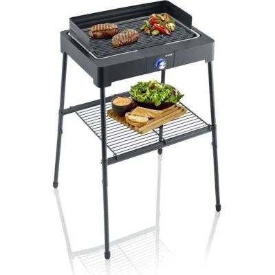 an image of a barbecue grill with meat and vegetables on it