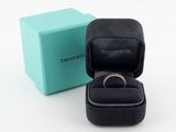 a box with a ring inside of it and a box with a ring inside of it