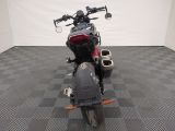 a picture of a motorcycle that is parked on a checkered floor