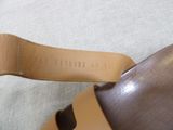 a close up of a pair of shoes that are on a bed
