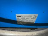 the back end of a blue car with a sticker on it ' s bumper