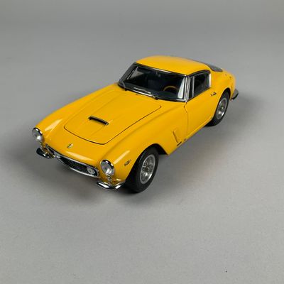 a yellow toy car that is sitting on a table