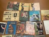 a lot of books that are on the table