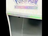 a close up of a pokemon card game on display
