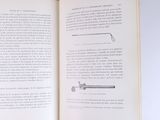 an open book with a picture of a pipe on it