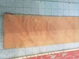 a large piece of wood on the floor of a subway station