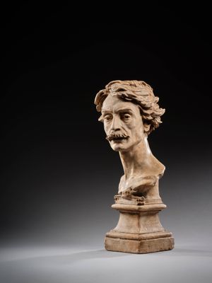 a carved bust of a man with a mustache on a pedestal