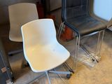 two chairs sitting next to each other in a room