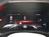 the dashboard of a car with a digital display on it
