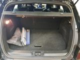 a trunk of a car with luggage inside of it