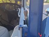 a close up of a door handle on a blue car