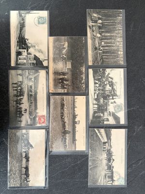 several black and white photographs of a train on a black surface