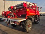 a red fire truck parked in front of a building