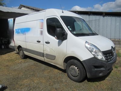 a white van that is parked in front of a building