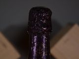 a close up of a bottle of wine on a table