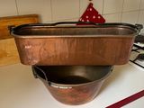 pots and pans sit on top of a stove in a kitchen