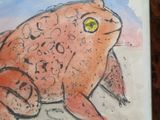 a drawing of a frog sitting on a table