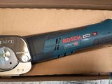 a bosch electric tool in a box on a table