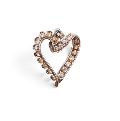 a close up of a diamond heart ring on a white background