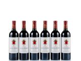 six bottles of red wine lined up in a row