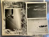 an old black and white photo of airplanes flying over a city