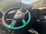 dashboard of a vehicle with a steering wheel and steering knobs
