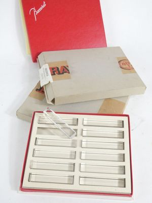 a red box with a white lid and a red box with a white lid and a red box with a white lid and a red box with a white