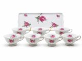 a set of six tea cups and saucers with pink roses on them