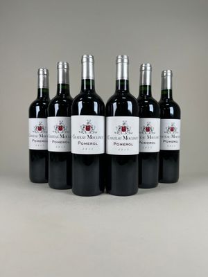 six bottles of red wine lined up in a row on a table