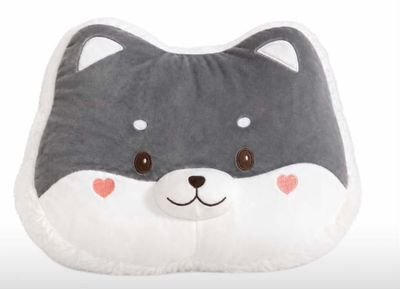 a gray and white pillow with a cat face on it