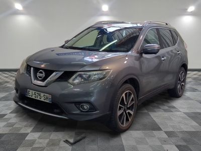 the front view of a grey nissan suv on a checkered floor