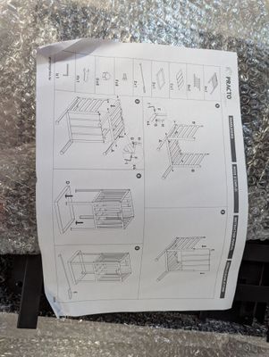 a sheet of paper with instructions on it sitting on the floor