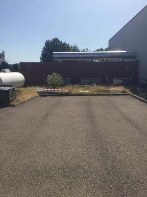 an image of an empty parking lot in front of a building