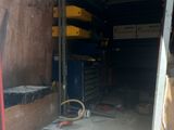 an image of a garage with a lot of tools in it