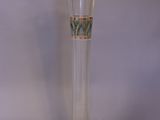 a clear glass vase with a floral design on it