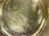 a close up of a metal plate with a hole in it