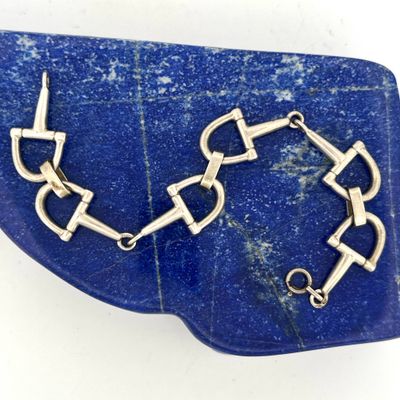 bracelet made of silver and blue stone on a blue stone slab