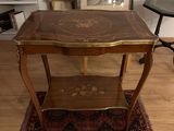 a small table with a picture on top of it