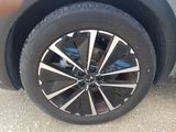 a close up of a tire on a car ' s rim