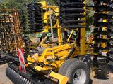 a tractor that is parked in the dirt