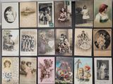 a lot of old postcards on display on the wall