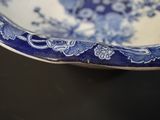 a blue and white bowl sitting on a table