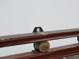 a wooden bench with a clock on top of it