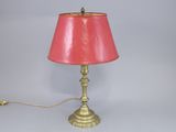 an image of a lamp with a pink shade on a table
