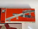 two boxed model trains sitting on a table
