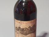 a bottle of wine that is sitting on a table