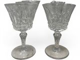 pair of clear glass goblets sitting on top of each other