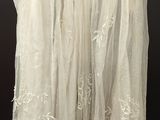 an image of a white skirt hanging on a hanger